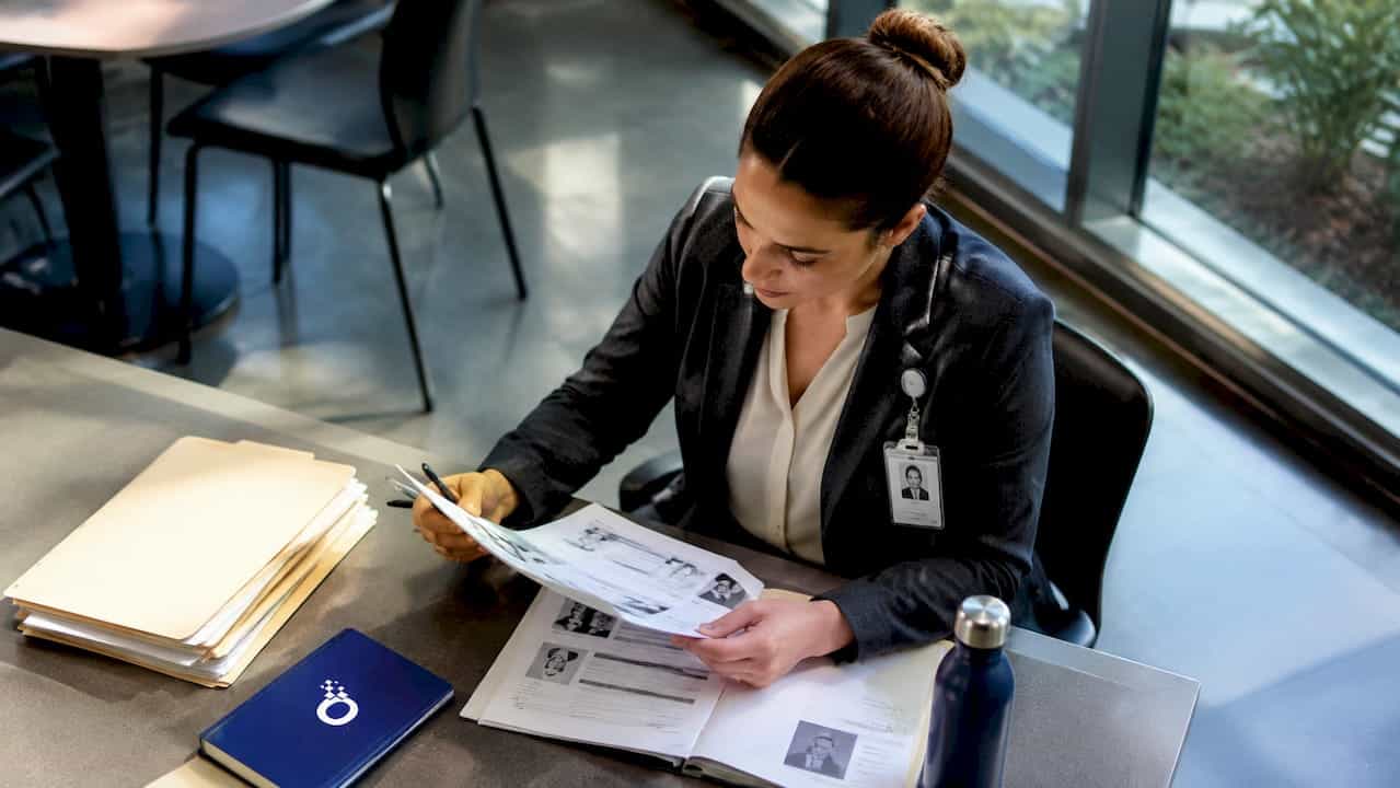 Supervisor reviewing workforce integrity reports