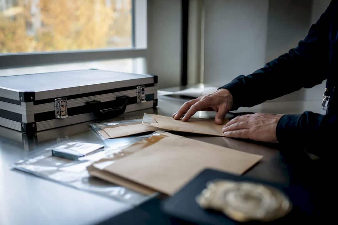 Investigator handling evidence and security tokens