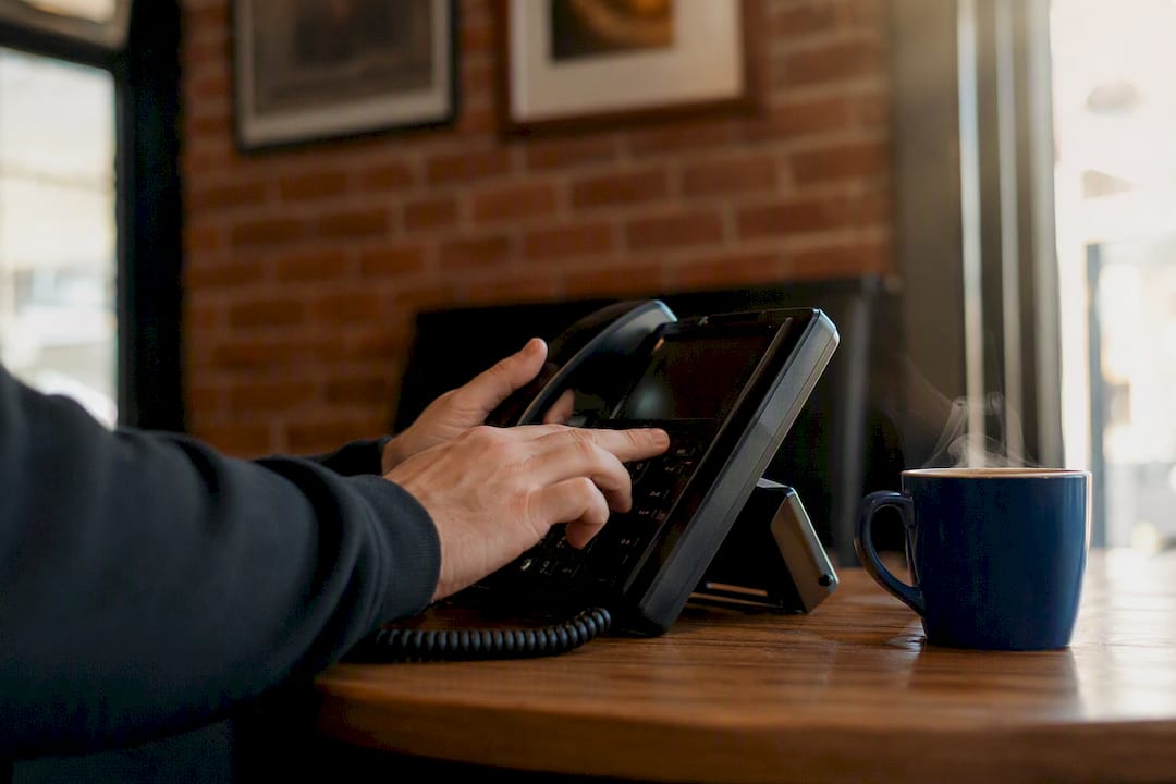 Investigators hands dialing phone to escalate delay