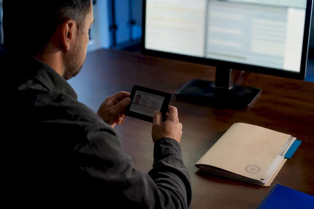 Investigator reviewing motor vehicle record access
