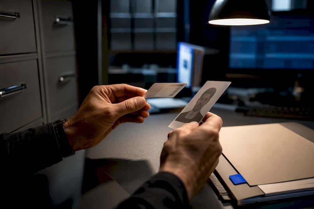 Investigator reviewing identity verification materials